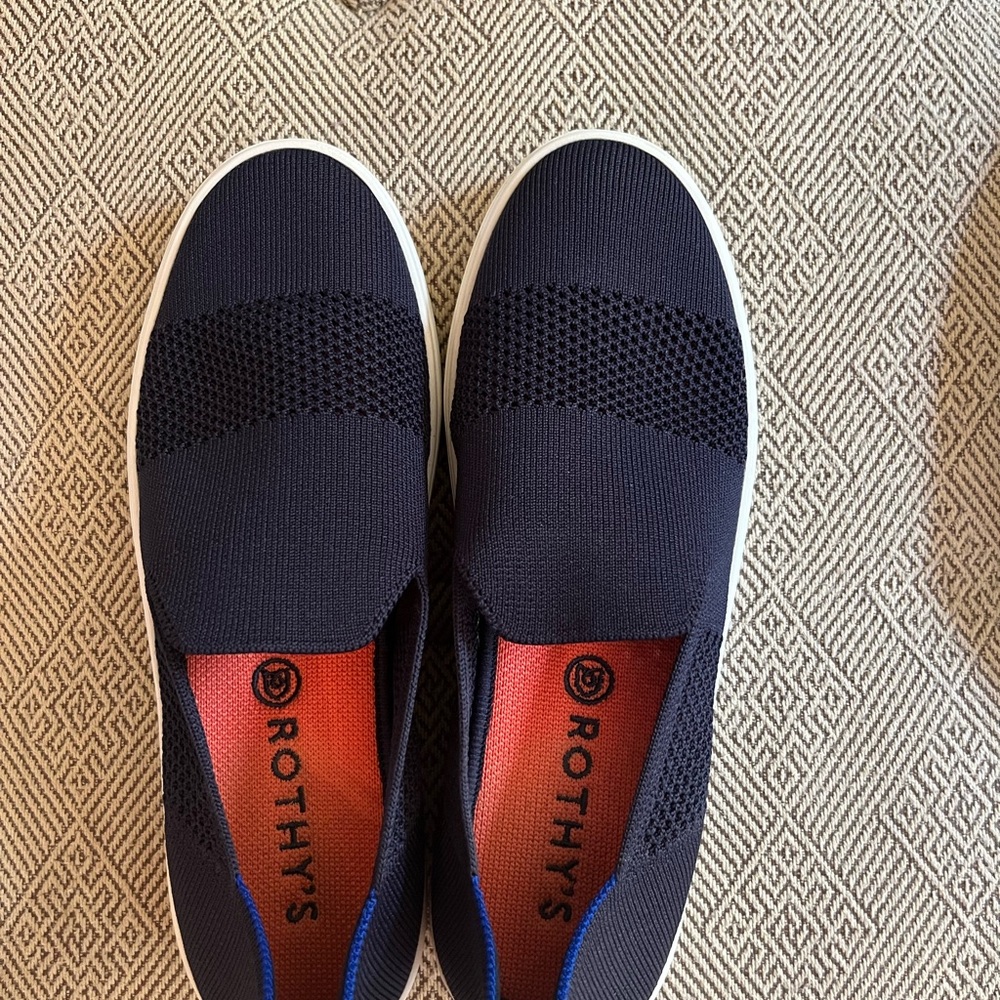 Rothy's Navy Slip-On Flats with Orange Insole